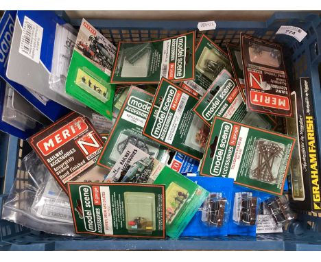 A large quantity of N gauge lineside accessorises including Graham Farish, Model Scene and Merit etc. Boxed.