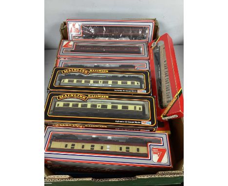Approximately twenty 'OO' gauge coaches from Hornby, Lima and Mainline etc. Boxed. One box.