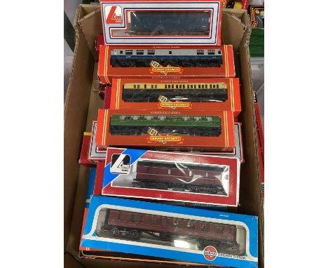 Approximately seventeen OO gauge outline coaches from Lima, Hornby, Airfix etc. boxed.