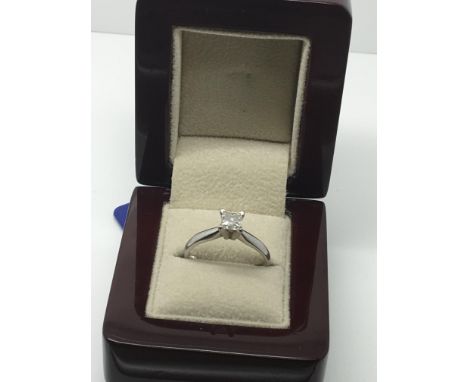 A quality Square cut Brilliant Diamond solitaire ring, the diamond colour grade E, and Clarity SI1 the diamond .60 of a caret