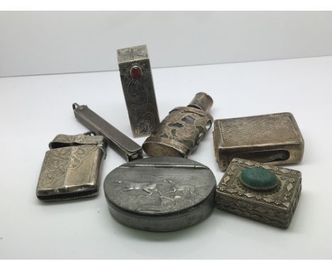 A collection of silver items including a vesta case lipstick holder a folding manicure set, and a 19th century pewter snuff b