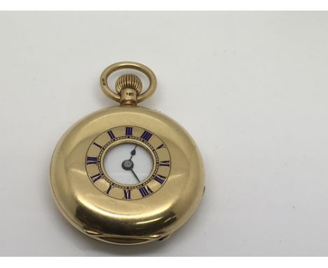 An 18ct gold half hunter pocket watch with blue enamel Roman numeral dial
