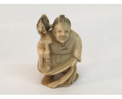 A Japanese late 19th Century ivory netsuke with character marks to base, approx height 5cm.