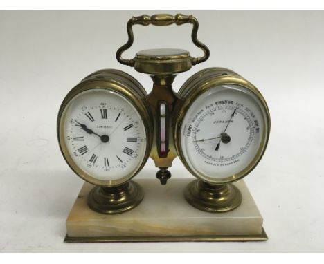 A brass desk clock & barometer.