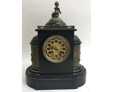 A Victorian black slate mantel clock.