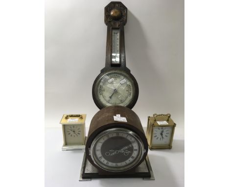 A oak wall barometer and three clocks