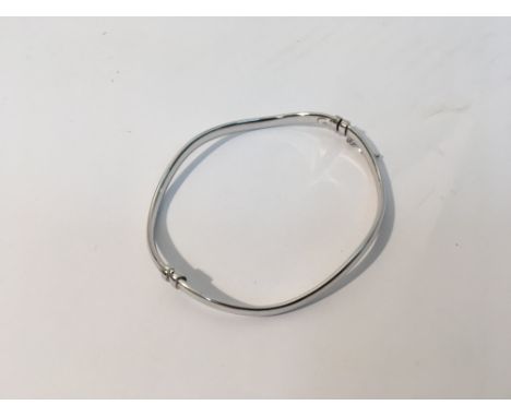 A 9ct white gold bangle. Weight approx 4.4g
