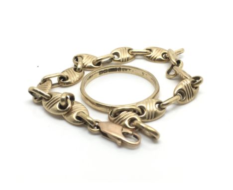 A 9ct wedding band, ring size V, approximate weight 2 grams, and yellow metal link bracelet weighing approximately 5.5 grams.