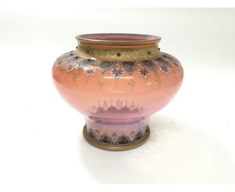 A bulbous pink glass vase with enamel decoration, crack to the base and chip to the rim.