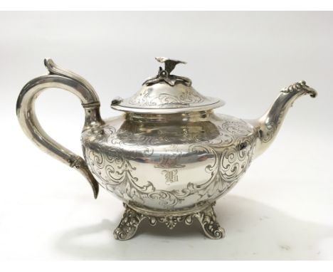 A Victorian silver teapot with floral handle. Hallmarked for London, 1846, maker possibly Joseph Angel & John Angel, total we