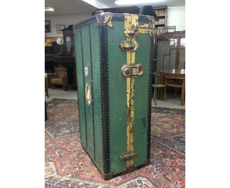 A large brass bound vintage green and black shipping trunk with Cunard Shipping labels and fitted interior, approximately 57c