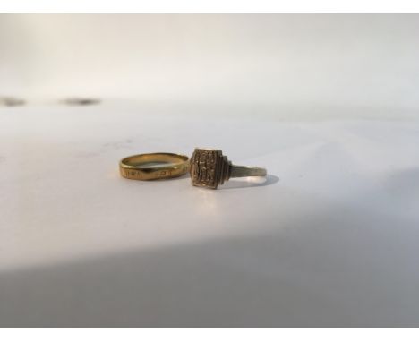 A 22ct gold ring with a 9ct gold ring. Sizes approx I (9ct) & M (22ct) Weight approx 1.6g (9ct) & 2.5g (22ct)