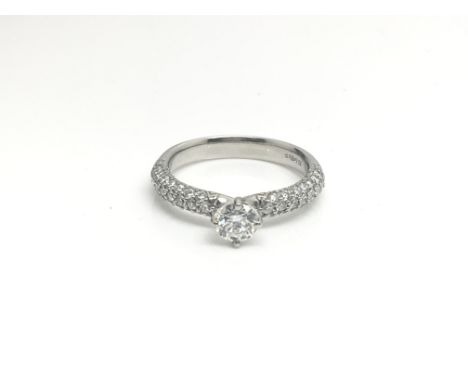 A platinum and diamond engagement ring with 0.88ct to 0.40ct centre, colour D, clarity VS2, ring size approximately L/M, tota