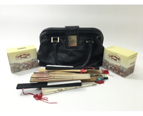 A collection of vintage fans, a vintage leather Biba bag and two David Winter cottages.