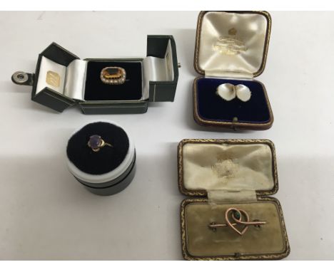 Three Edwardian brooches and a gold ring.