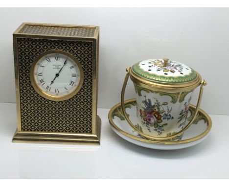A Halcyon Days Enamel clock and a conforming potpourri with a matching dish in the form of a small bucket decorated with flow