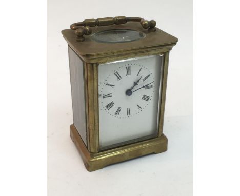 A brass cased carriage clock.
