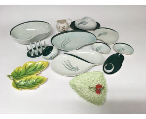 A collection of various Carltonware to include a two leaf dish, a leaf dish with tomatos, a white and gold milk jug and a col