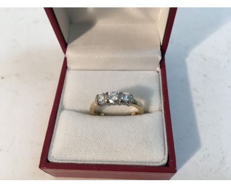 A ladies 18ct yellow gold ring set with three graduating brilliant diamonds possible colour F, clarity VS2. Size approx J Wei