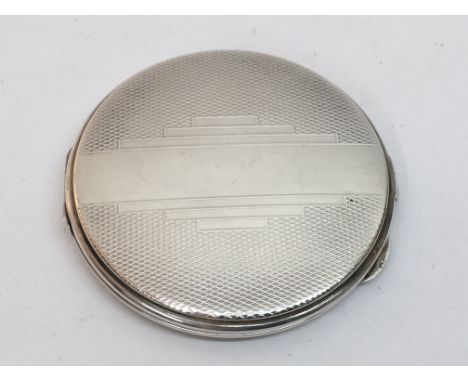 An Art Deco silver compact, Birmingham 1941.