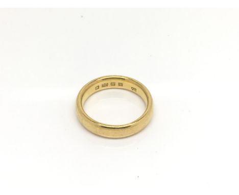 A 22ct gold wedding ring 8.5g approximately.