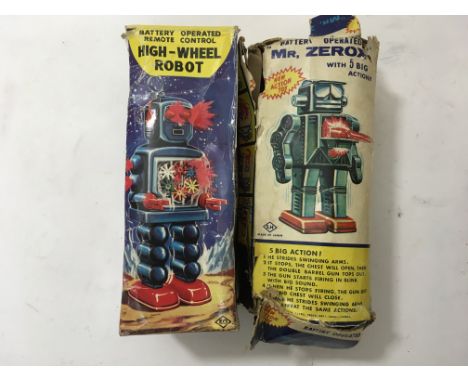 A boxed "High Wheel " robot by KO, together with a boxed " Mr Zerox " robot by SH both being battery operated , both boxes a/