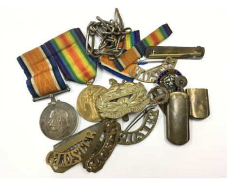 Two First World War medals and a small selection of military badges including examples for Gloster and Egypt as well as a vin