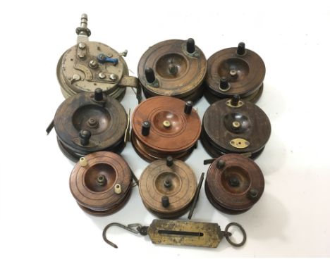 A collection of nine vintage fishing reels, mainly wooden Victorian Nottingham reels, to include an Orlando III, a Cruise and