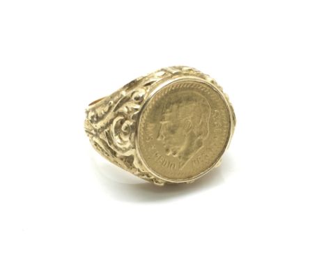 A gent's gold ring set with a 1945 Spanish dos pesos coin, total weight approximately 10 grams, ring size approximately S.