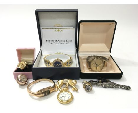 A small collection of ladies watches to include a ring watch of folate design, a Majesty of Ancient Egypt watch, a Curtis Lib
