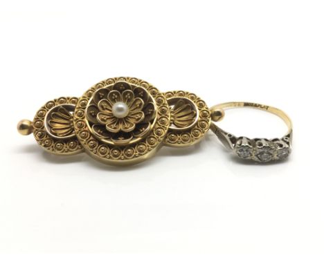 A ladies 18ct yellow gold and platinum ring inset with a row of three diamonds, ring size P, weight approximately 2 grams, al