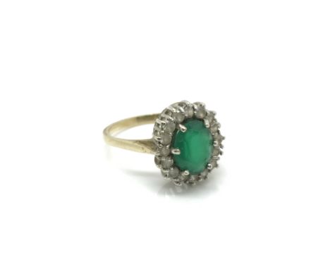 A 9ct yellow gold white sapphire and emerald cluster ring. Approx size M, total weight approximately 2.7 grams.