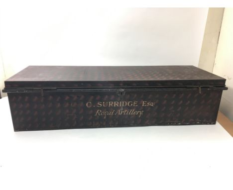 A tin military trunk with handles, makers label for Fishers Military Outfitters of Wollwich, London, painted to the front to 