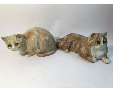 Two ceramic cats.