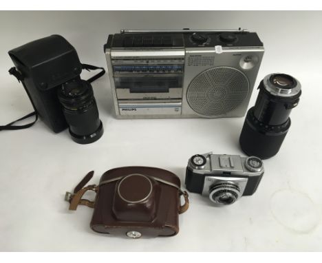 A box of collectibles including a Zeiss camera, vintage radios and binoculars etc.