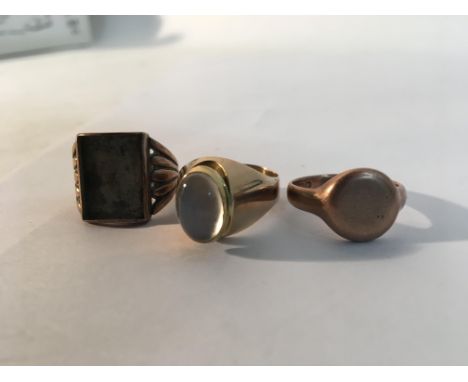Three gold gents rings, one marked 9ct and one mounted with a moonstone. Weight total approx 19.7g Sizes approx S, R & P/Q