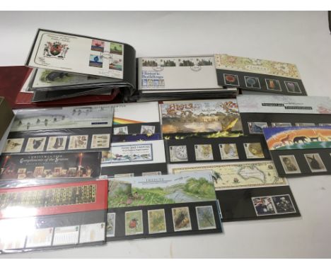 A bag containing first day covers and Royal Mail mint stamps