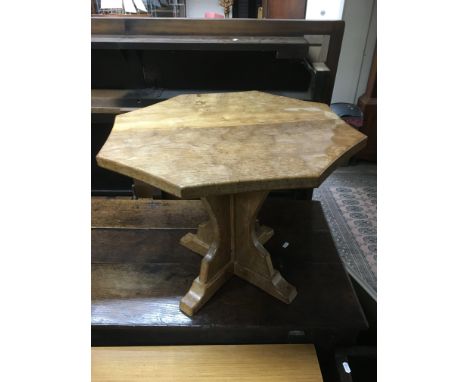 A hand crafted oak occasional table by The Old Mill, furniture craftsman of Thirsk, the table with an octagonal Adze cut top 