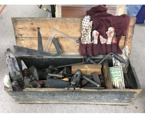 A wooden toolbox and contents including a Stanley plane