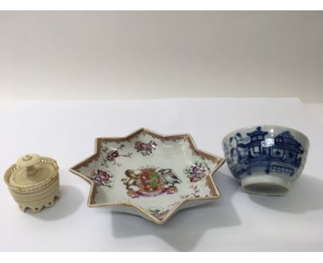 A Samson pottery star shaped dish painted in the Chinese stylewith an armourial crest of a shield flanked by two birds, appro