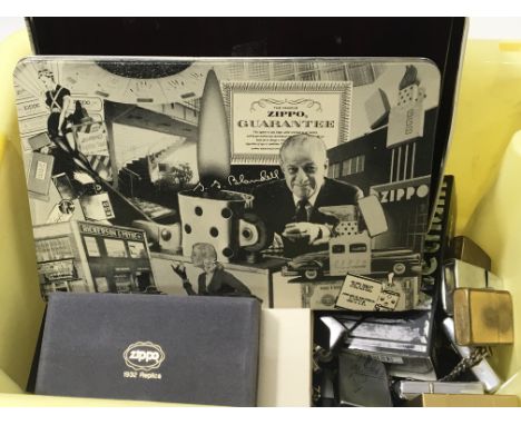 A collection of vintage Zippo lighters including some Vietnam retrospective lighters.