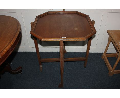 An oak 'Revertable' occasional / card table with octagonal top on folding stand, 61.5cm