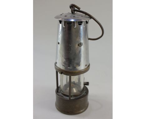 A metal miner's lamp, missing maker's plaque, 27cm