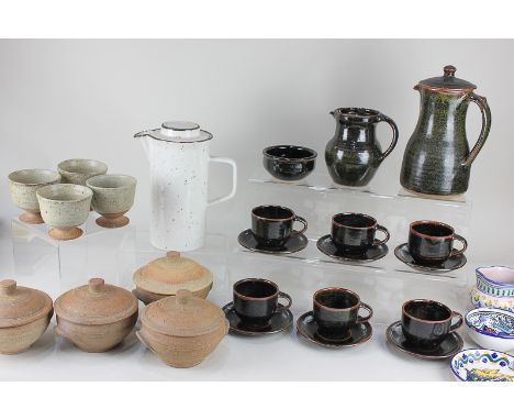 A Winchcombe pottery coffee set comprising coffee pot, milk jug, sugar bowl, and six cups and saucers, and a set of four Leac