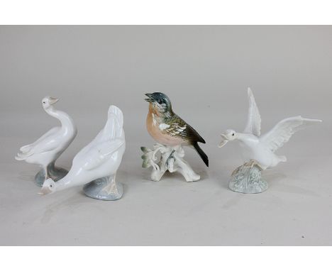 A Karl Ens porcelain model of a finch, 12cm, together with two Lladro models of geese, and a Nao goose