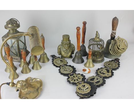Seven 'Old Money' horse brasses, a brass lantern, a miniature bird cage, a brass money box, a hand bell, a desk lamp with ink
