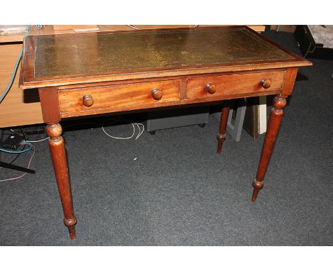 A Victorian mahogany writing table with rectangular green leather inset top and two drawers, on tapered baluster legs, 102cm