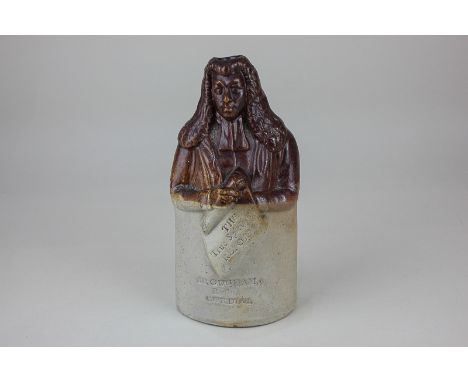 A Doulton and Watts brown stoneware Brougham Reform cordial flask with a portrait of Lord Chancellor Brougham holding a banne