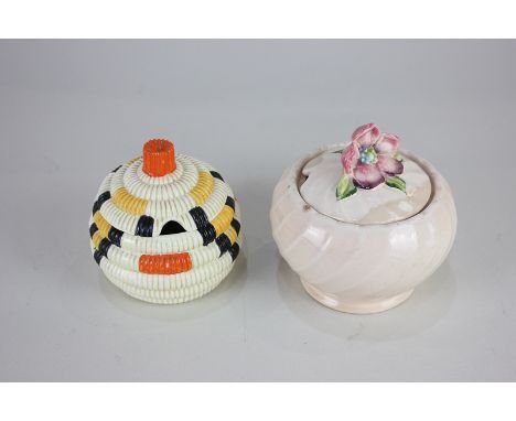 Clarice Cliff Bizarre Wilkinsons Pottery preserve pot and cover, with orange, yellow and black ridged design, together with a