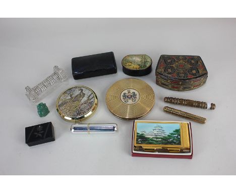 A Le Rage compact with crest 'Per Mare Ubique', another compact, two brass bobbin cases, four trinket boxes, a jade lucky cat